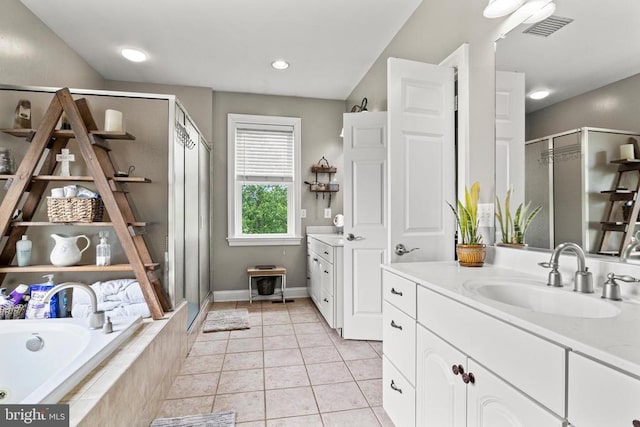 bathroom with vanity, separate shower and tub, and tile patterned flooring