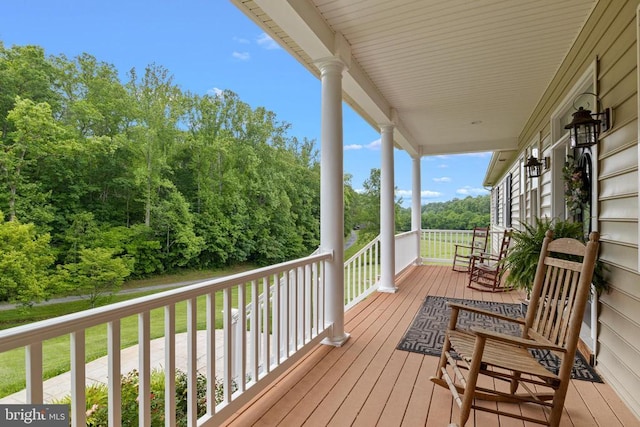 wooden terrace featuring a porch