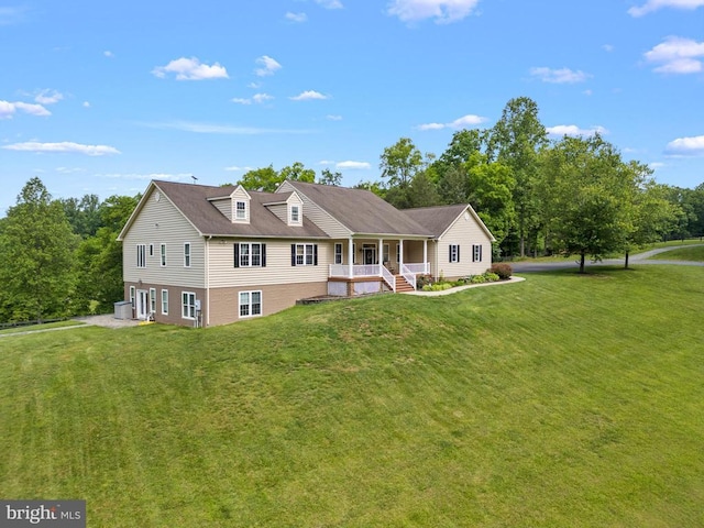 view of front of property with covered porch and a front lawn