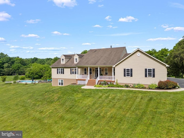 view of front of property with covered porch and a front lawn