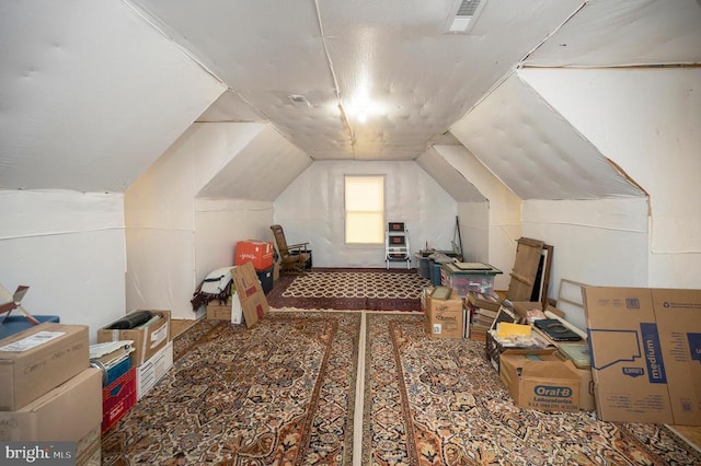 bonus room with vaulted ceiling and visible vents