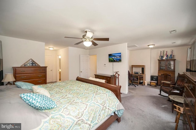 carpeted bedroom with visible vents and ceiling fan