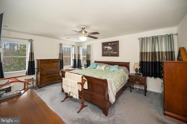 bedroom with carpet flooring, baseboards, and ceiling fan