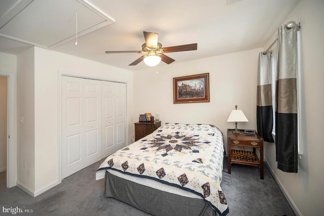 bedroom with ceiling fan, baseboards, attic access, carpet floors, and a closet