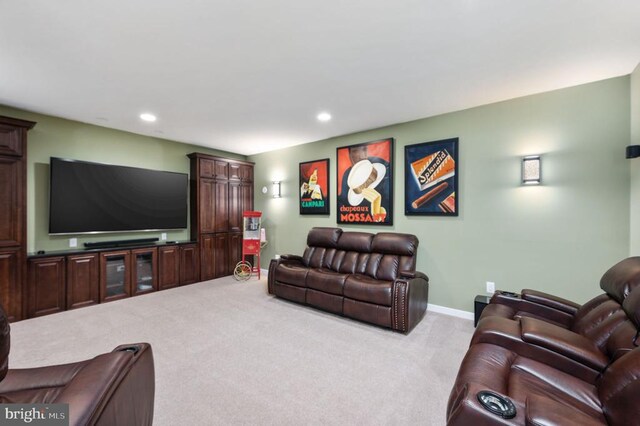 living room featuring carpet flooring, recessed lighting, and baseboards