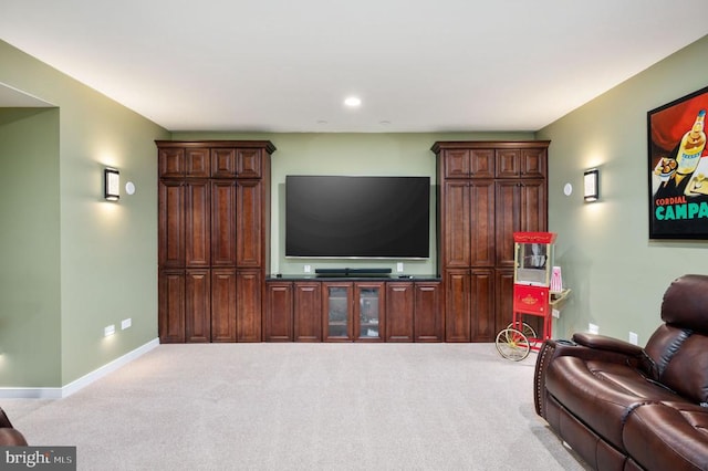 carpeted living room with recessed lighting and baseboards