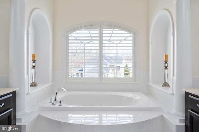 full bath featuring a bath and vanity