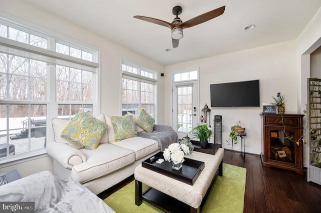 living area with dark wood finished floors, plenty of natural light, recessed lighting, and ceiling fan