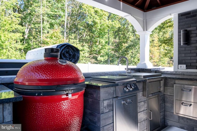 view of patio / terrace featuring a gazebo and area for grilling