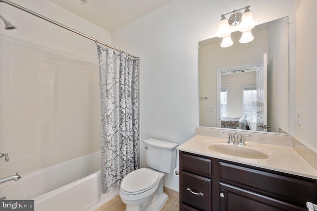 ensuite bathroom featuring toilet, shower / tub combo with curtain, connected bathroom, tile patterned flooring, and vanity