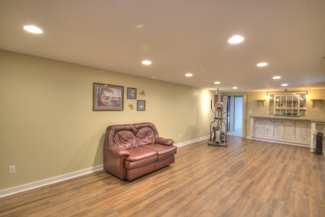 sitting room with recessed lighting, baseboards, and wood finished floors