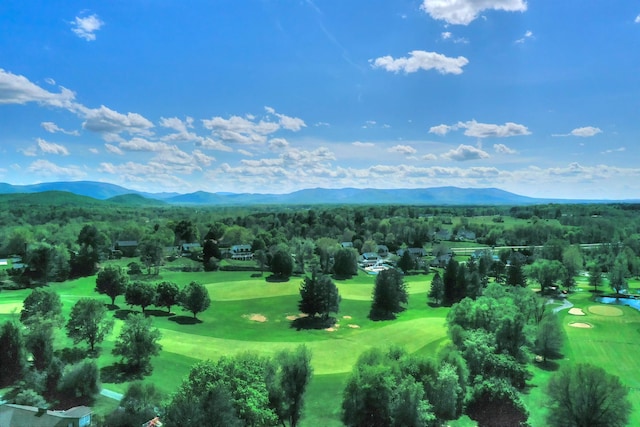 aerial view featuring view of golf course and a mountain view
