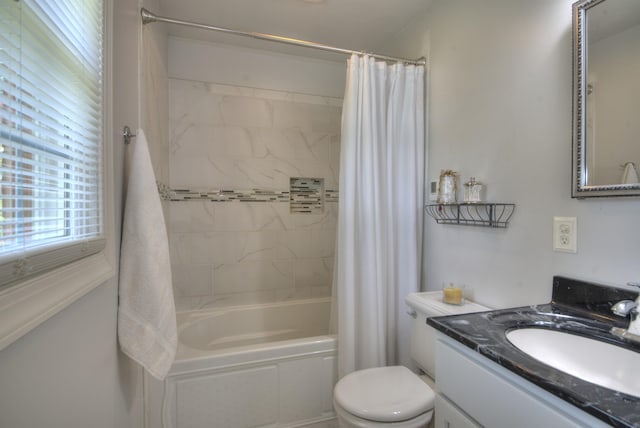 bathroom featuring vanity, toilet, and shower / bath combination with curtain