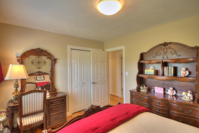 bedroom featuring a closet and wood finished floors