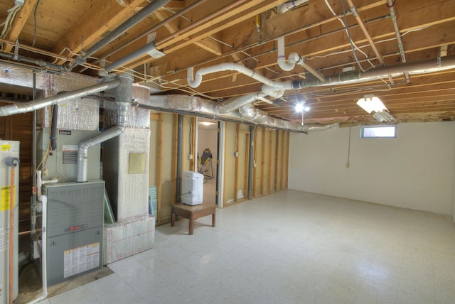 below grade area with heating unit and tile patterned floors