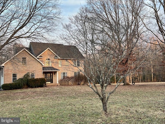 view of front facade with covered porch and a front lawn