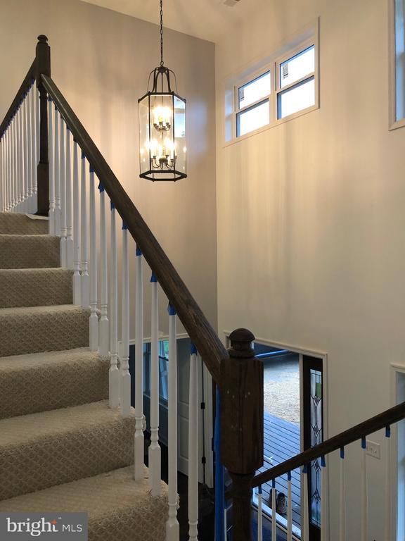 stairway with a high ceiling