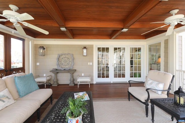 living room with wood-type flooring, coffered ceiling, ceiling fan, wood ceiling, and french doors