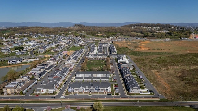 birds eye view of property featuring a residential view and a water and mountain view