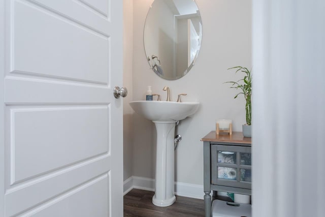 bathroom featuring baseboards and wood finished floors