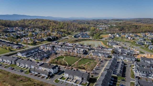 bird's eye view with a residential view, a view of trees, and a water and mountain view