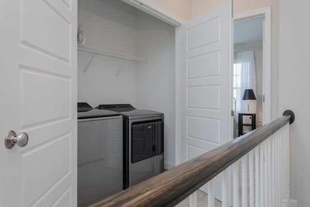washroom with washer and dryer