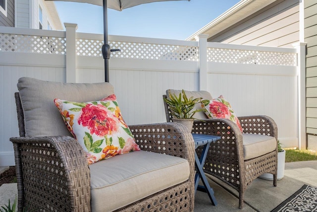 view of patio / terrace featuring fence