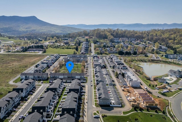 bird's eye view with a water and mountain view
