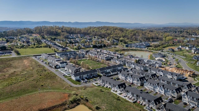 aerial view featuring a water and mountain view