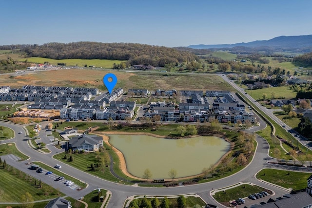 birds eye view of property featuring a water and mountain view
