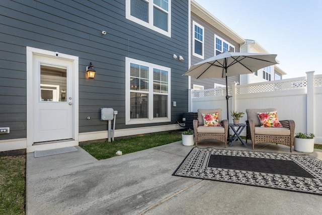 view of patio featuring fence