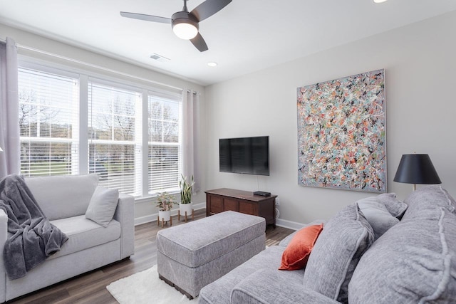 living room featuring wood finished floors, ceiling fan, baseboards, visible vents, and recessed lighting