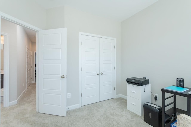 office space with light carpet and baseboards