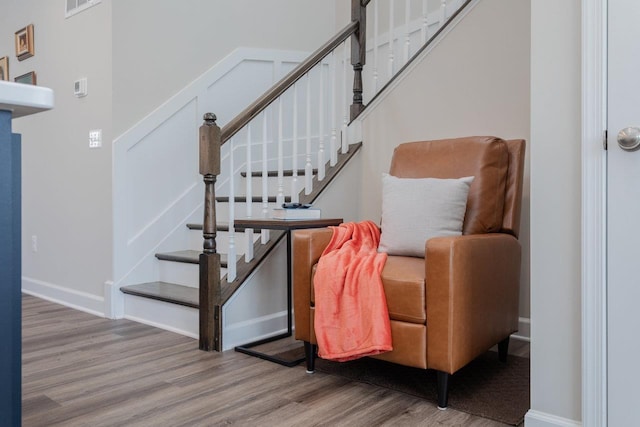 stairs with baseboards and wood finished floors