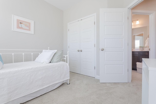 carpeted bedroom with a closet