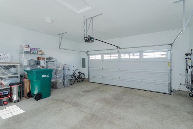 garage featuring electric panel and a garage door opener