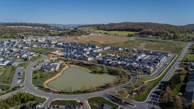 drone / aerial view featuring a residential view and a water view