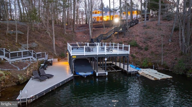 view of dock with a deck with water view