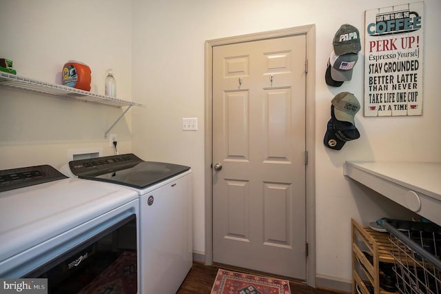 laundry room with laundry area, washer and dryer, and dark wood-style floors