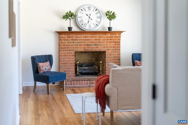 living area featuring a fireplace and hardwood / wood-style flooring