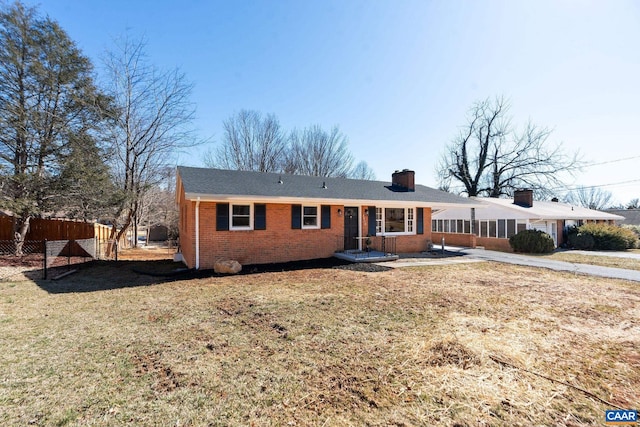 ranch-style house with a front lawn