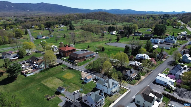 aerial view with a mountain view, a residential view, and a forest view