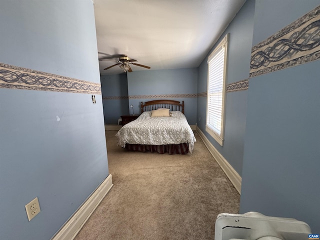 bedroom featuring ceiling fan, carpet floors, and baseboards