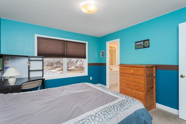 bedroom featuring carpet, connected bathroom, and baseboards