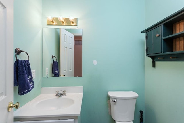 half bath with toilet and vanity