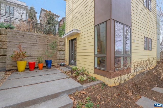 view of property exterior with fence