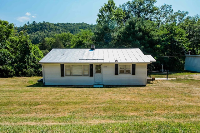 view of front of home with a front yard