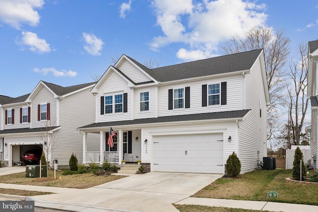 traditional-style home featuring concrete driveway, a porch, roof with shingles, and an attached garage