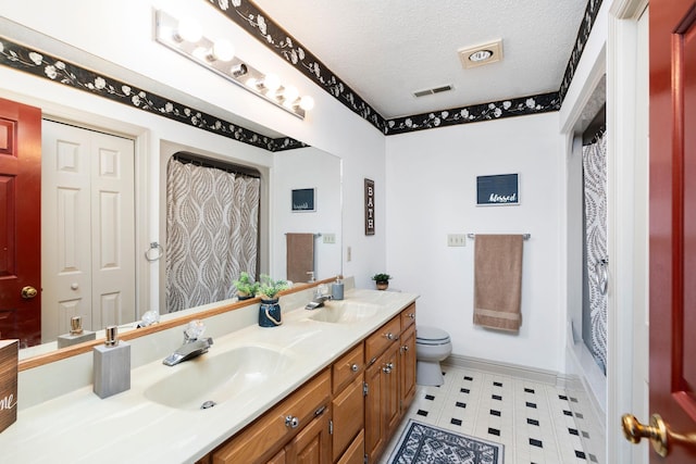 full bathroom with a textured ceiling, toilet, vanity, and shower / bath combo with shower curtain