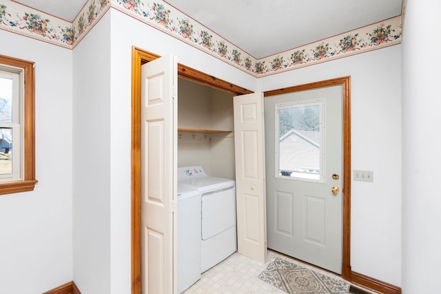 washroom featuring washing machine and dryer